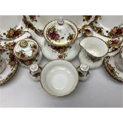 Royal Albert Old Country Roses tea service, comprising teapot, milk jug, covered sucrier, open sucrier, salt and pepper, twelve dessert plates, cake plate, seven cups and eight saucers  