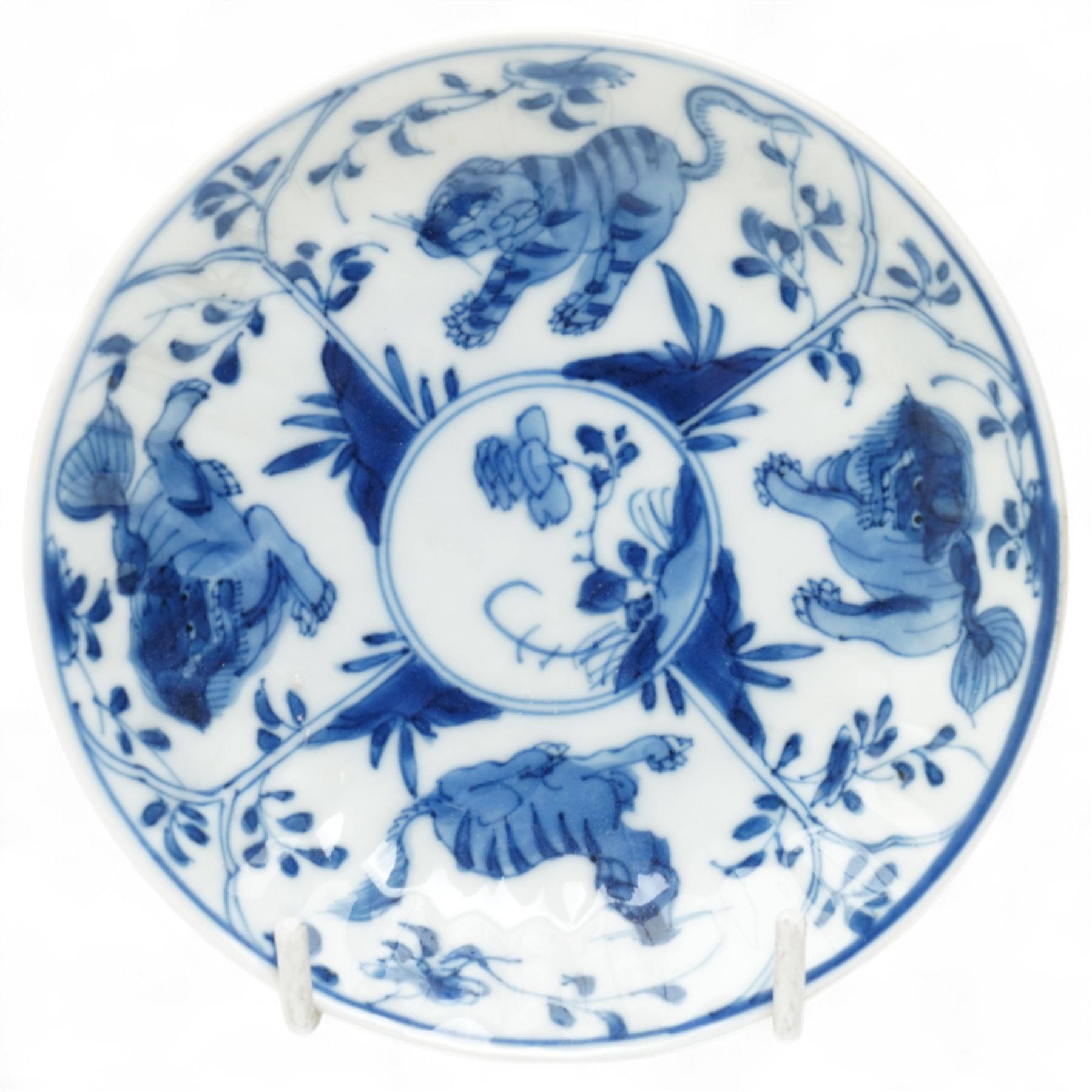 Set of six Chinese blue and white saucers, mostly Kangxi period, comprising matching pair decorated with insects and birds, example with painted lions and tigers, four bearing blue painted 'lingzhi' fungus mark to base, the others unmarked (6)