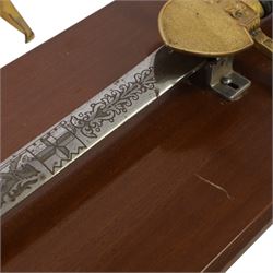 Wilkinson Sword, with 76cm double edge blade, etched with makers name and decoration, wooden grip, brass guard and hilt, together with another sword