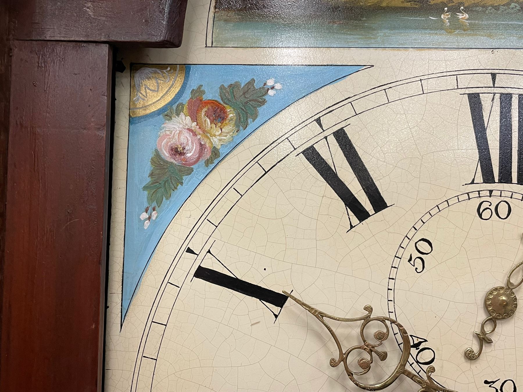 Musson of Louth - mid-19th century oak and mahogany 8-day longcase clock, with a swan’s neck pediment and ball and spire brass finial, break arch hood door flanked by reeded pilasters with brass capitals, canted angled trunk, flat topped door with concave corners, rectangular plinth on bracket feet, fully painted break arch dial with Roman numerals and minute track, subsidiary seconds dial and calendar aperture, matching stamped brass hands, eight day rack striking movement with anchor escapement. With weights and pendulum.
H206 W44 D23
Balthazar Musson from Baden (Germany) is recorded as working in Louth from 1835, naturalised 1861-8. Succeeded by his son, George Balthazar 1872-1920. 
