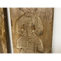 Two 20th century hardwood Dutch folk art Speculaasplank or biscuit moulds, typically carved with figures in traditional dress, largest H101cm