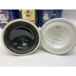 Bells, Scotch whisky, in seven Wade ceramic decanters, comprising two Christmas decanters 1990 and 1991, 60th birthday of Queen Elizabeth II decanter, Golden Wedding anniversary of the Queen and the Duke of Edinburgh decanter, Birth of Princess Beatrice decanter, Birth of Princess Eugenie decanter and Queen's mothers, together with Bells, blended Scotch whiskies, three miniatures in Wade ceramic decanters, various contents and proofs