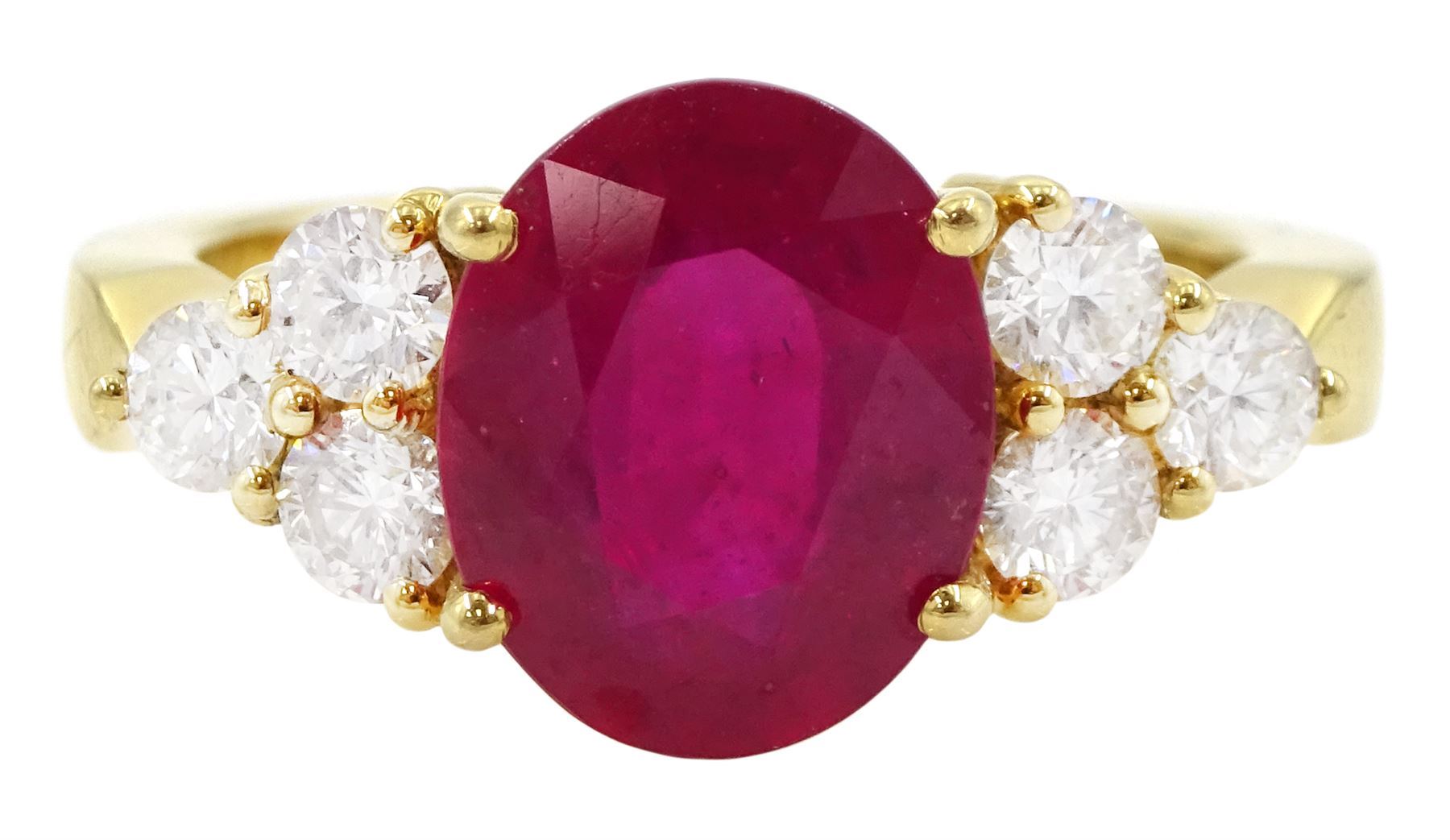 18ct gold ruby and diamond ring, single oval cut ruby of approx 5.35 carat, with three round brilliant cut diamonds set either side, stamped, total diamond weight approx 1.00 carat