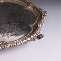 Late Victorian silver salver, of lobed circular form, with foliate beaded rim and engraved floral decoration to centre, upon three claw and ball feet, hallmarked Martin, Hall & Co Sheffield 1896, D26cm