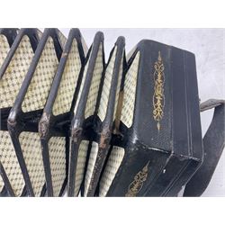 19th century Lachenal concertina of hexagonal form with fretworked nickel ends and thirty-four plus one bone buttons; straps marked Lachenal & Co Makers London and wooden handle stamped English Make Trade Mark L16cm