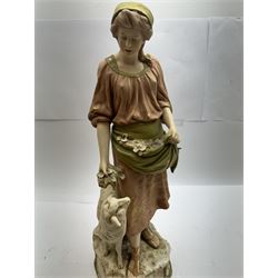 Pair of Royal Dux figures, no. 1115, modelled as a shepherd with a goat by his side and a shepherdess feeding a lamb, each wearing flowing green and pink robes with gilt detailing, with pink triangle mark beneath, H51cm