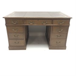 Edwardian oak twin pedestal partners desk, brown leather inset top, twelve drawers, two cupboards, plinth base, W140cm, H77cm, D91cm