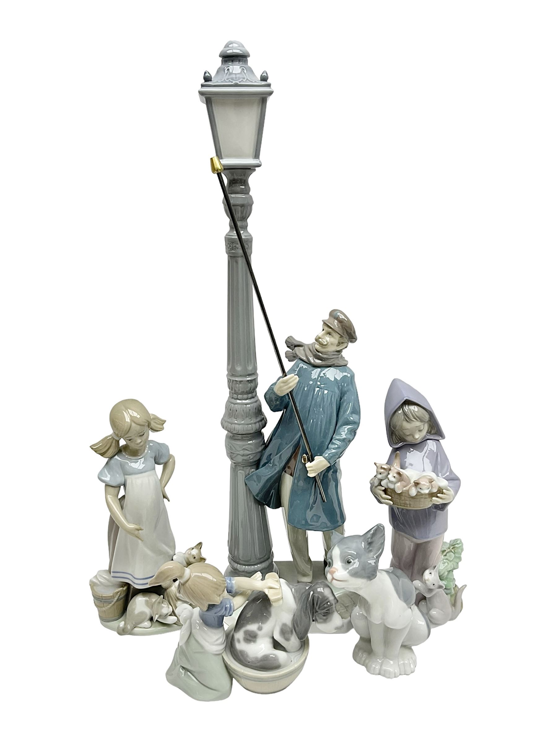 Five Lladro figures, including The Lamp Lighter no 5205,  Girl and Kittens no 6102, Cat no 5113 etc