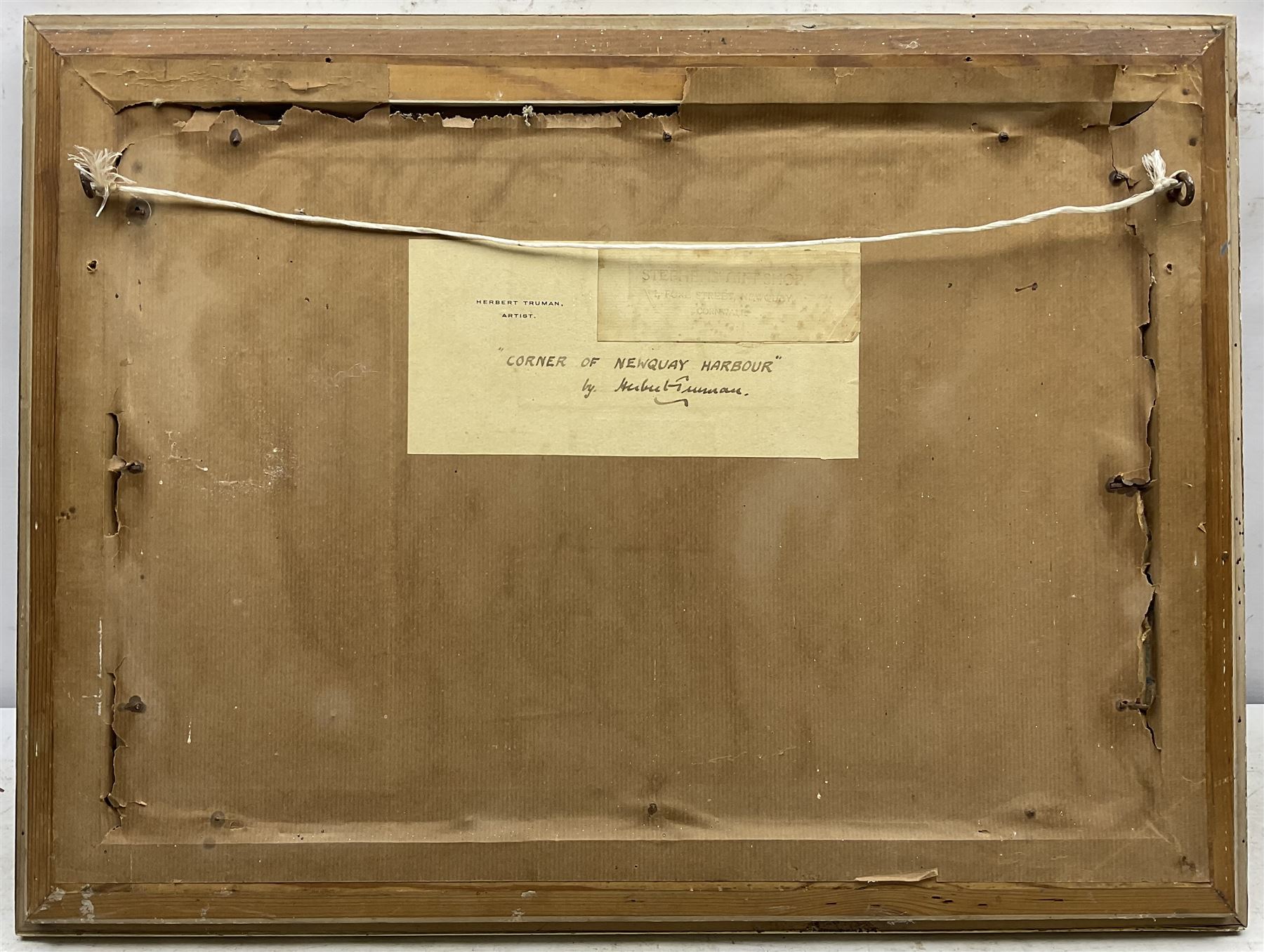 Herbert Truman (St. Ives 1883-1957): ‘Corner of Newquay Harbour’, oil on board signed, titled on label verso 31cm x 45cm