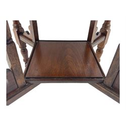 Victorian oak occasional table, octagonal top with bevelled edges, lower section fitted with a square undertier united by decorative shaped stretchers, on turned supports with castors