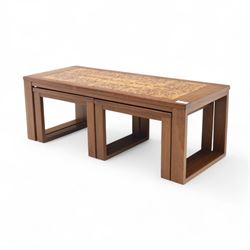Mid-20th century ‘Long John’ teak nest of coffee tables, rectangular form with ceramic tile inset top, enclosing two smaller square tables with matching tile decoration
