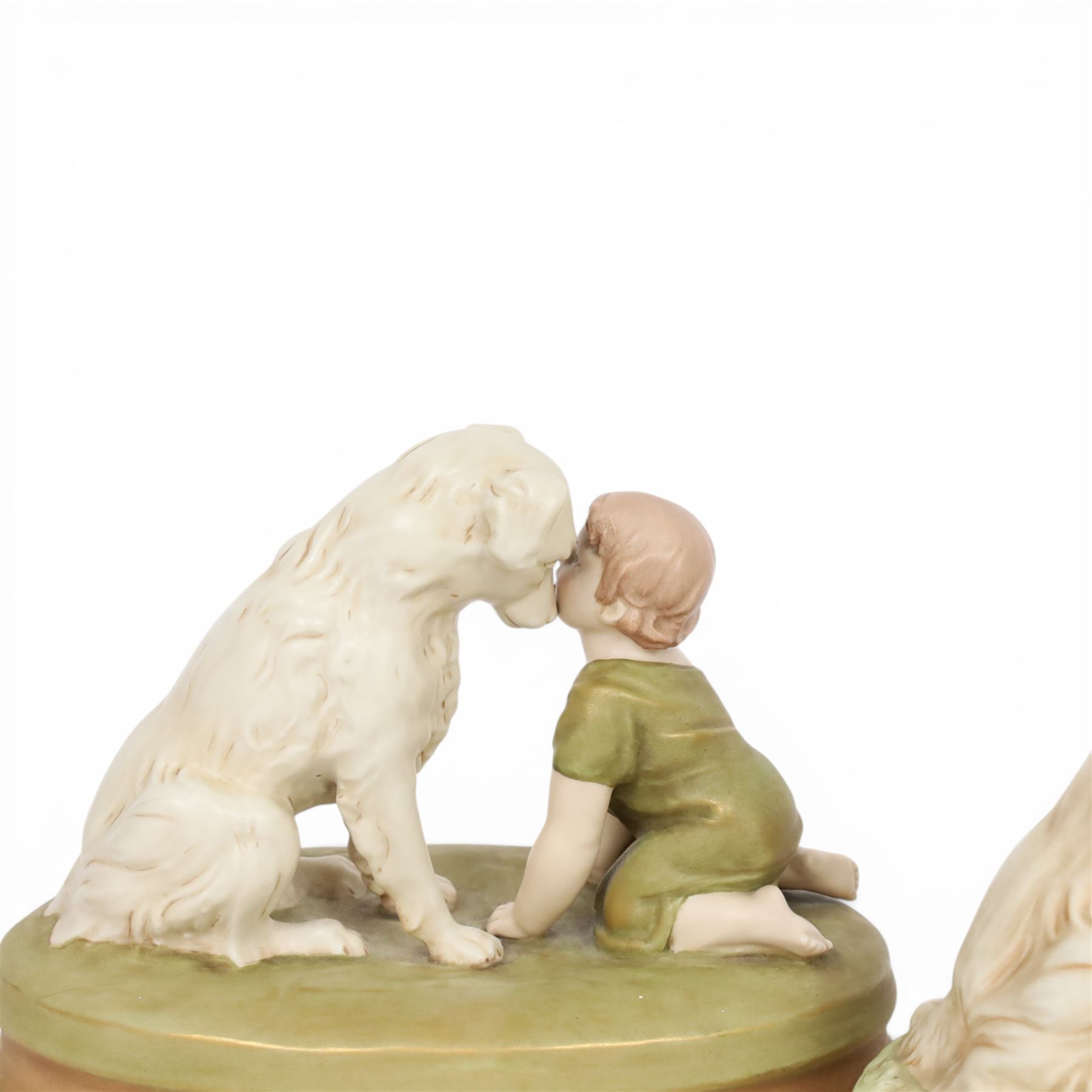 Two Royal Dux figures, each modelled as a toddler and dog, upon oval base, one titled 'Can't you talk?', model no 2369, each with applied and impressed marks beneath, largest example H19cm