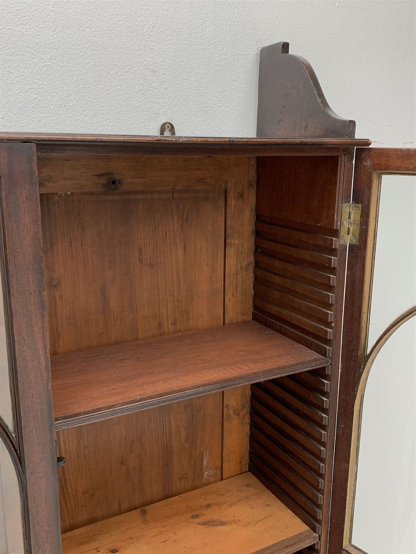 Georgian mahogany Gothic wall hanging cabinet, enclosed by two ogee pointed arch astragal glazed doors, plain sides with shaped top and bottom brackets