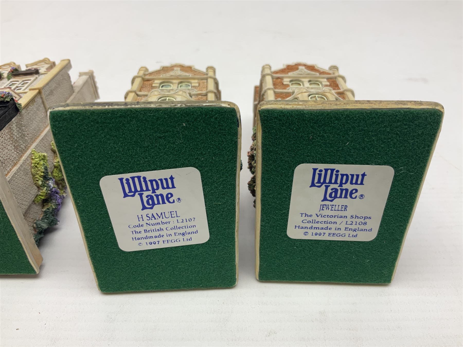 Thirteen Lilliput Lanes from the Shops Collection, including Apothecary, Horologist, China Shop, Penny Sweets, H Samuel etc, all with deeds and original boxes 