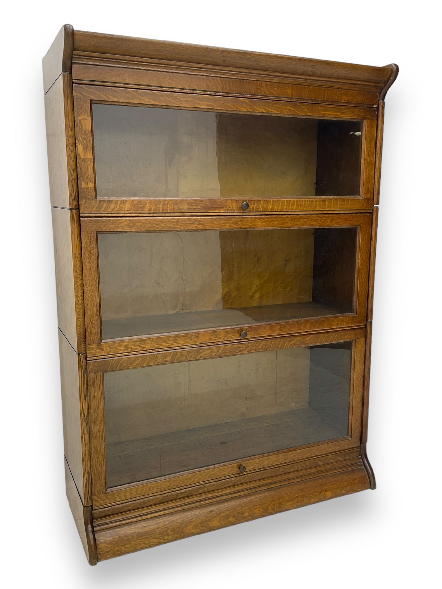 Early 20th century oak three-tier stacking library bookcase, enclosed by hinged and sliding glazed doors