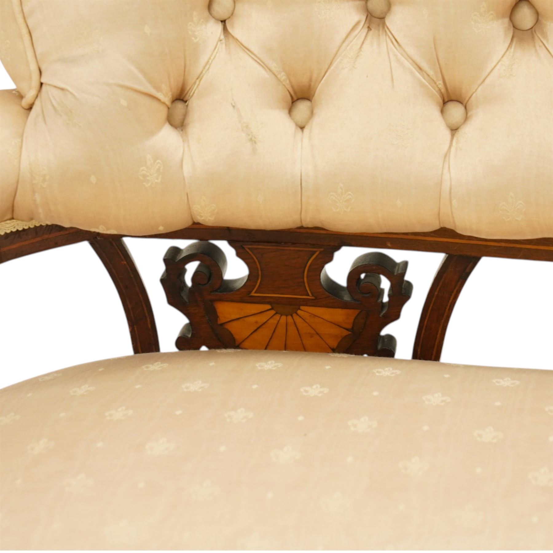 Edwardian inlaid mahogany sofa, upholstered in cream fabric with buttoned back rail, tapering legs on brass castors