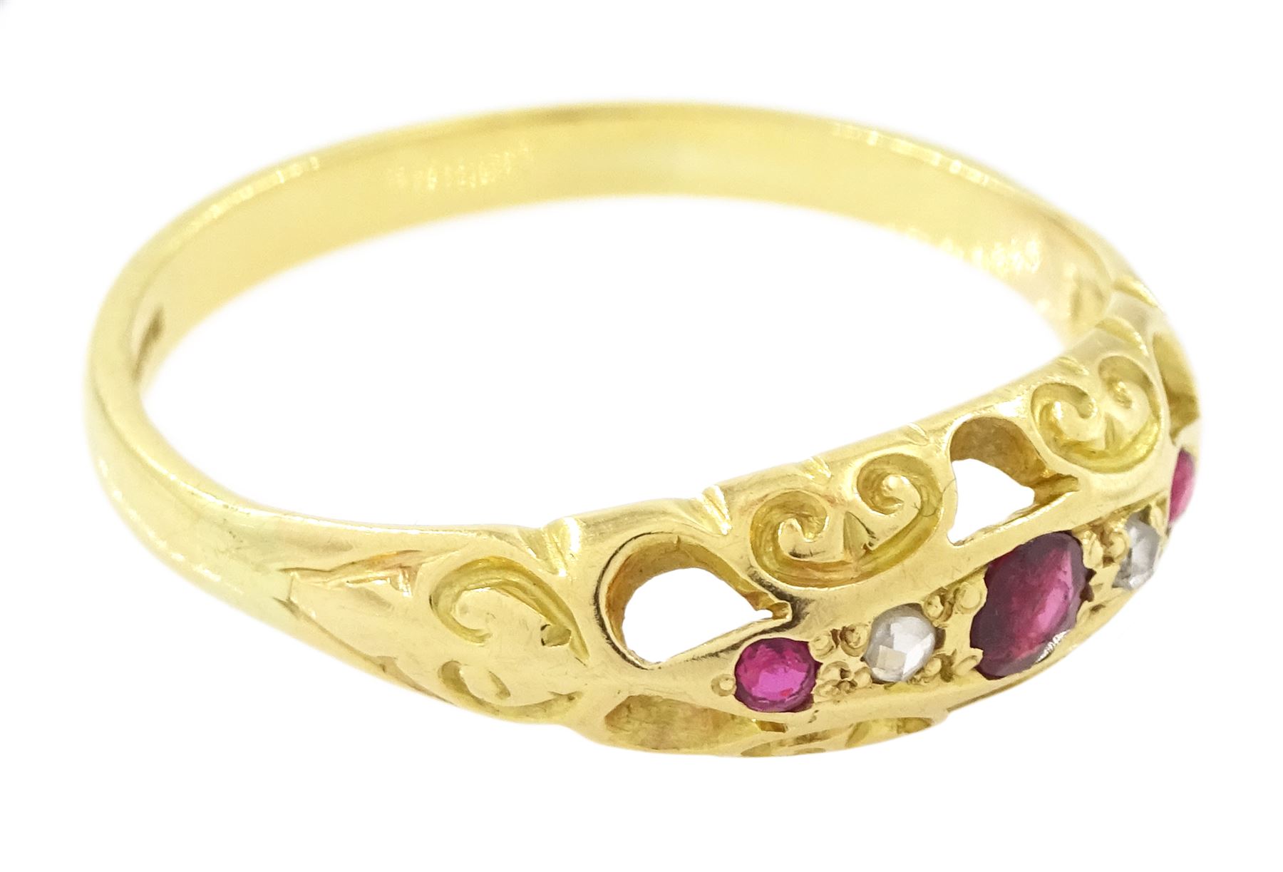 18ct gold ruby and diamond ring, five alternate round cut rubies and rose cut diamonds, in a scroll design setting, Sheffield 2004