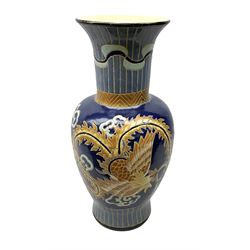 Oriental crackle glaze floor vase decorated with a dragon upon a blue ground, H66cm