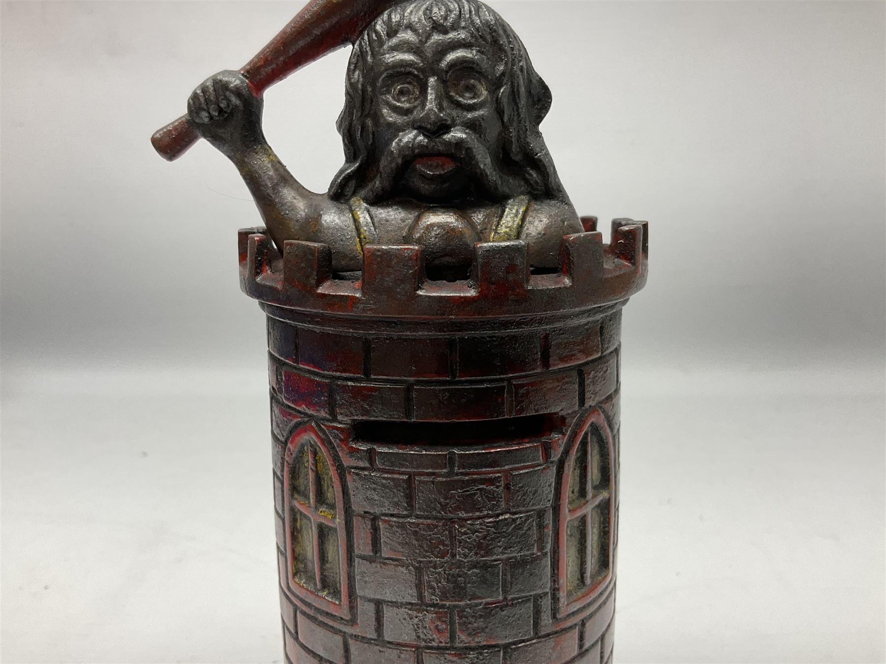 Late 19th century cast-iron mechanical money bank 'Giant in Tower' by John Harper & Co; reg.no.196844, patented 13th August 1892 H23cm