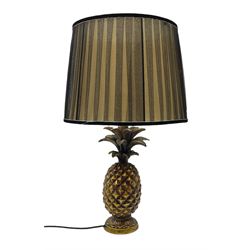 Pineapple table lamp, gilded and painted details, with a pleated fabric lampshade, H58.5cm

