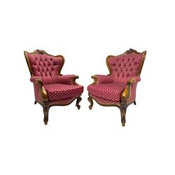  Pair of French design beech framed armchairs, moulded frame carved with foliate cartouche, scrolled arms carved with foliage terminating to cabriole feet, upholstered in buttoned red patterned fabric