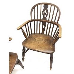 Set four early to mid 19th century elm Windsor armchairs, low pierced splat and stick backs, dished seats, turned supports joined by H shaped stretchers          