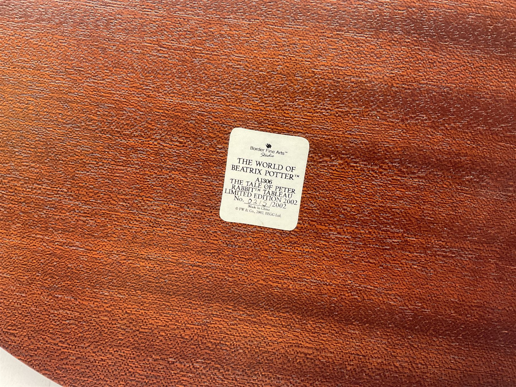 Four Border Fine Arts Beatrix Potter figures, comprising Tableau created to commemorate the Millenium together with a Border Fine Arts Limited Edition no 669814, The Tale of Peter Rabbit Tablet A1306, Four Little Rabbits A2442 and Sailing Home A2443