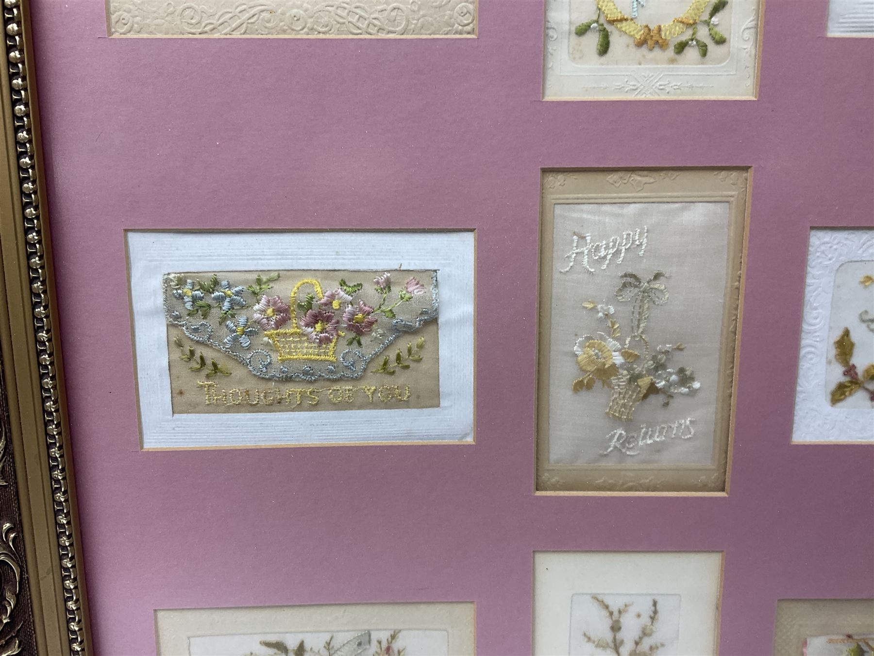 Thirty-five WW1 embroidered silk postcards including regimental crests, flags of the Allies, envelope type with greeting card inserts, Christmas and birthday cards etc; mounted and glazed in three graduated modern matching gilt frames (3)