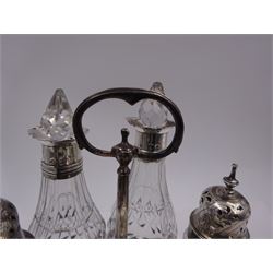 Late 18th century silver cruet stand, of oval form, with pierced sides upon four bun feet, hallmarked to handle Hester Bateman, all other hallmarks indistinct, together with five matched silver mounted cut glass cruet bottles, including some later Victorian examples, hallmarks predominantly indistinct, stand H20cm