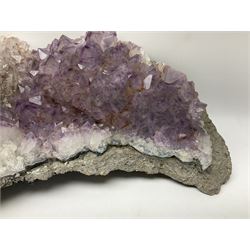 Amethyst crystal geode cluster, with well-defined crystals of various sizes, H13cm, L46cm