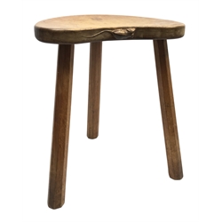 'Mouseman' oak three legged stool with kidney shaped dished seat, by Robert Thompson of Kilburn, 37cm x 30cm, H46cm