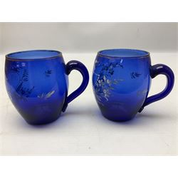 Pair of Victorian cobalt blue glass cups with gilt and painted decoration, entitled Hope's the Balm of Life and Love me as I Love Thee, H8.5cm