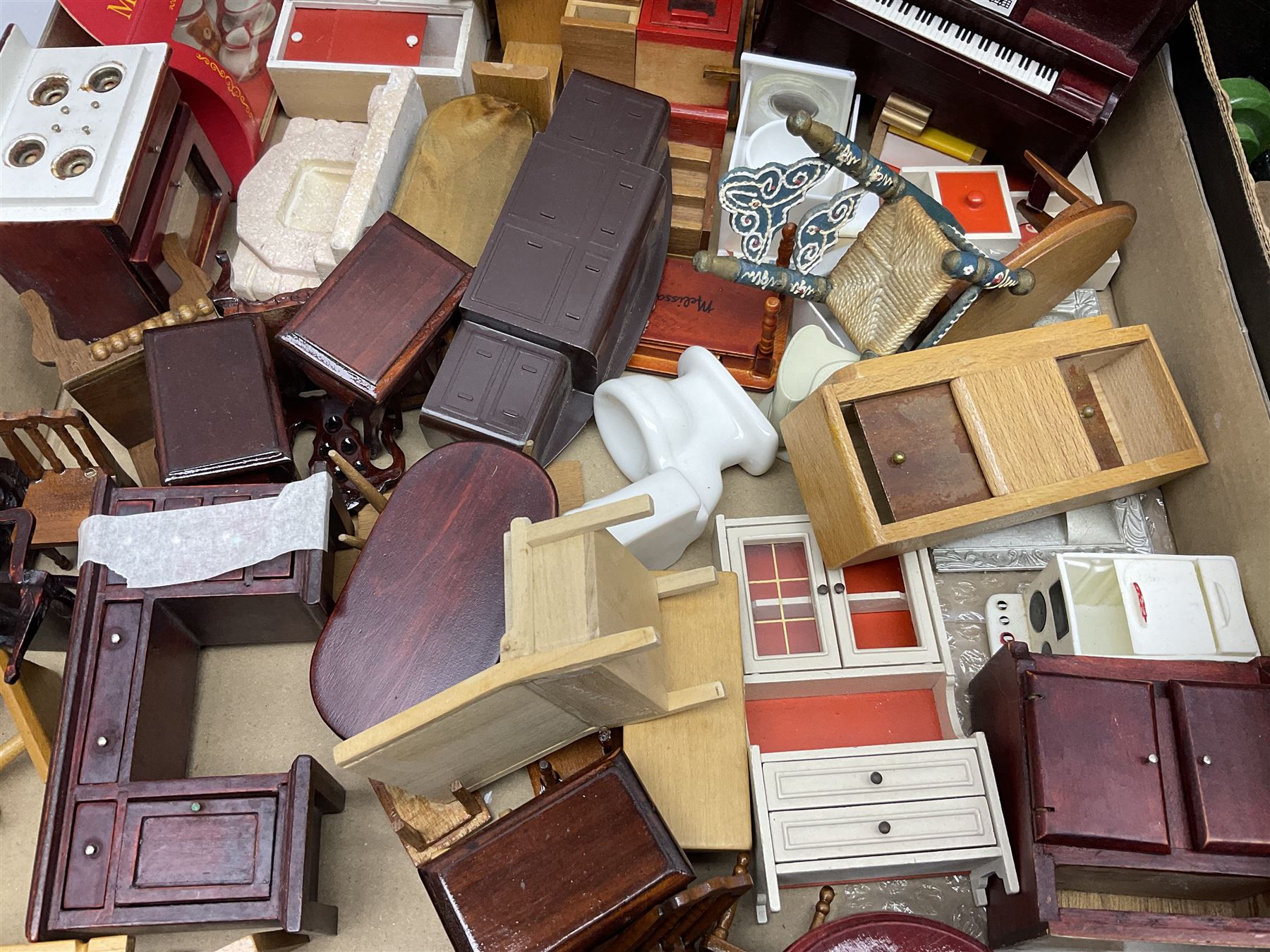 Large quantity of 1970s doll's house furniture, predominantly stained or painted wooden, including lounge, dining room, kitchen and bedroom pieces, bathroom fittings, bureaux and desks, piano, lamps, fire-surrounds etc; various scales