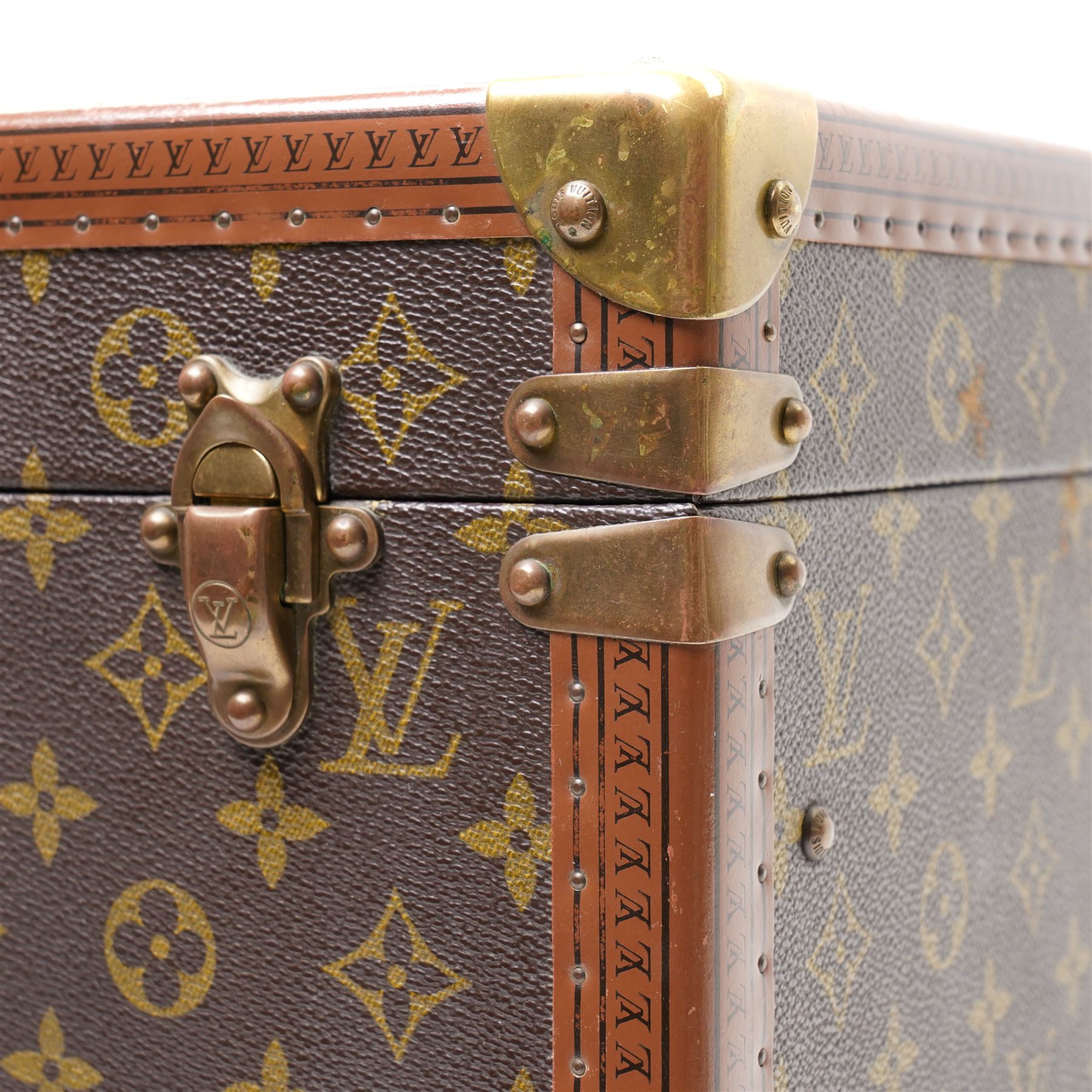 Mid-20th century Louis Vuitton monogram cabin trunk,  monogram canvas with lozine trim and brass mounts, single front leather handle with lock stamped Louis Vuitton with key code 1080701, the interior fitted with original webbing straps and lift-out tray, label to lid printed 'Avenue Marceau 78bis - Paris Nice - 2 Avenue de Suède' serial number 953998, circa1960s, with original key present
