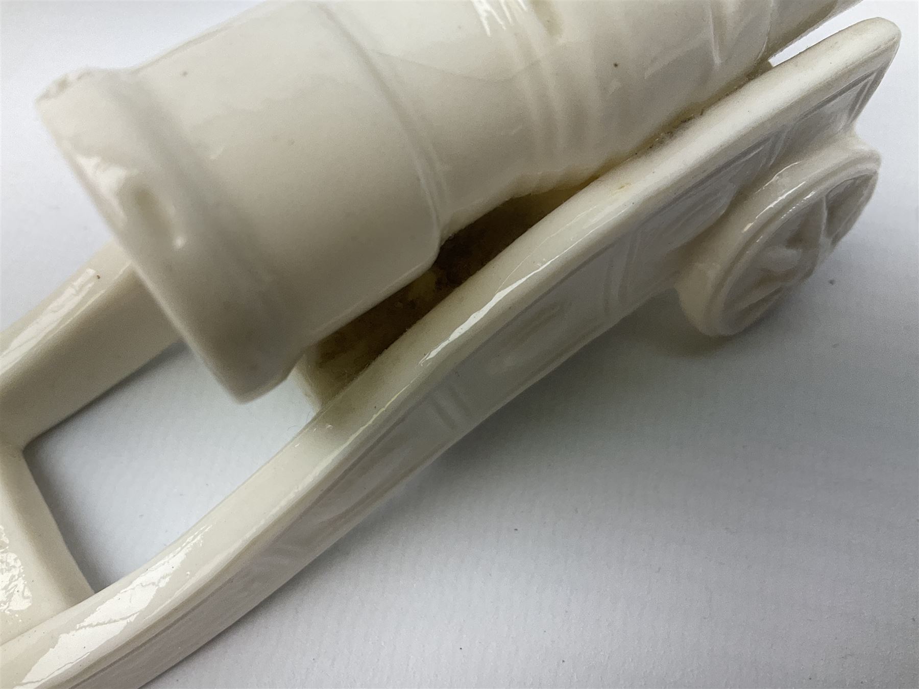 Three pieces of crested ware, comprising grenade detailed 'The Mills Hand Grenade' with Filey Crest, marked beneath Grafton China, a cannon with crest banner detailed 'Sterlini Oppidvm', marked beneath W H Goss, and a submarine with Tunbridge Wells crest, marked beneath Arcadian China 