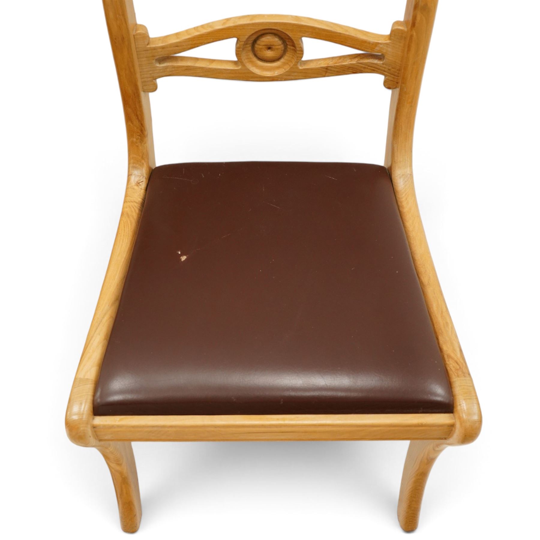 Seahorseman by Shaw & Riley - set of four Yorkshire oak bar-back dining chairs, brown vinyl drop in seat, raised on shaped supports with signature Seahorse carving from the workshop of A. Shaw & Riley Ltd, Hessay