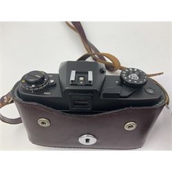 Leitz Leicaflex SL2 camera body, serial no.1387046, with 'Summicron-R 1:2/50 Leitz Wetzlar' lens, serial no. 2273397, within a leather Leitz lens hood 