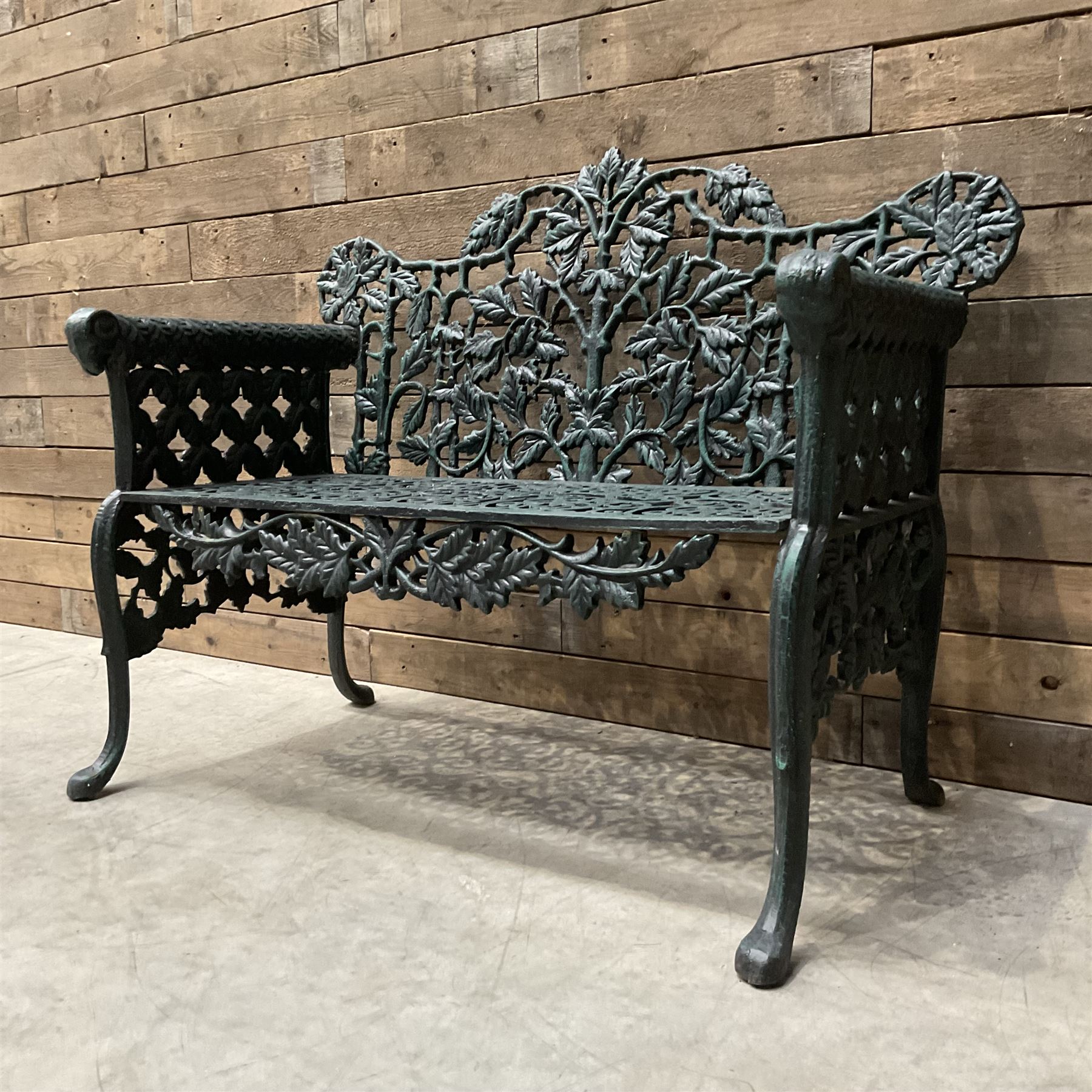 Victorian design heavy cast iron garden bench, ornate shaped back with rope twist and ramshead arms H88cm, W100cm