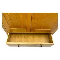 Contemporary light oak double wardrobe, projecting cornice over two panelled doors enclosing hanging rail and shelf, above full-width drawer, on shaped stile supports