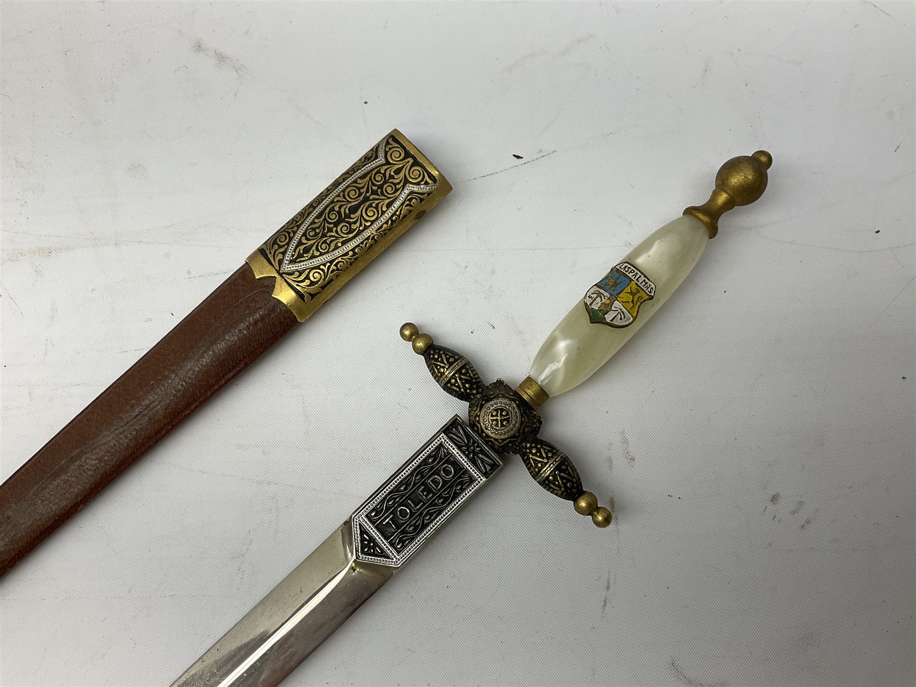 Malayan Kris dagger, the 31.5cm double edged straight heavy damascus blade with copper ferrule; carved hardwood grip; in large wooden throated scabbard with floral decorated white metal covering L47.5cm overall; a kris blade with adapted antler grip; and five various small daggers/letter openers (7)