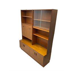 G-Plan - mid-20th century teak modular wall cabinet, fitted with shelves, display cabinet, fall front compartment and two double cupboards