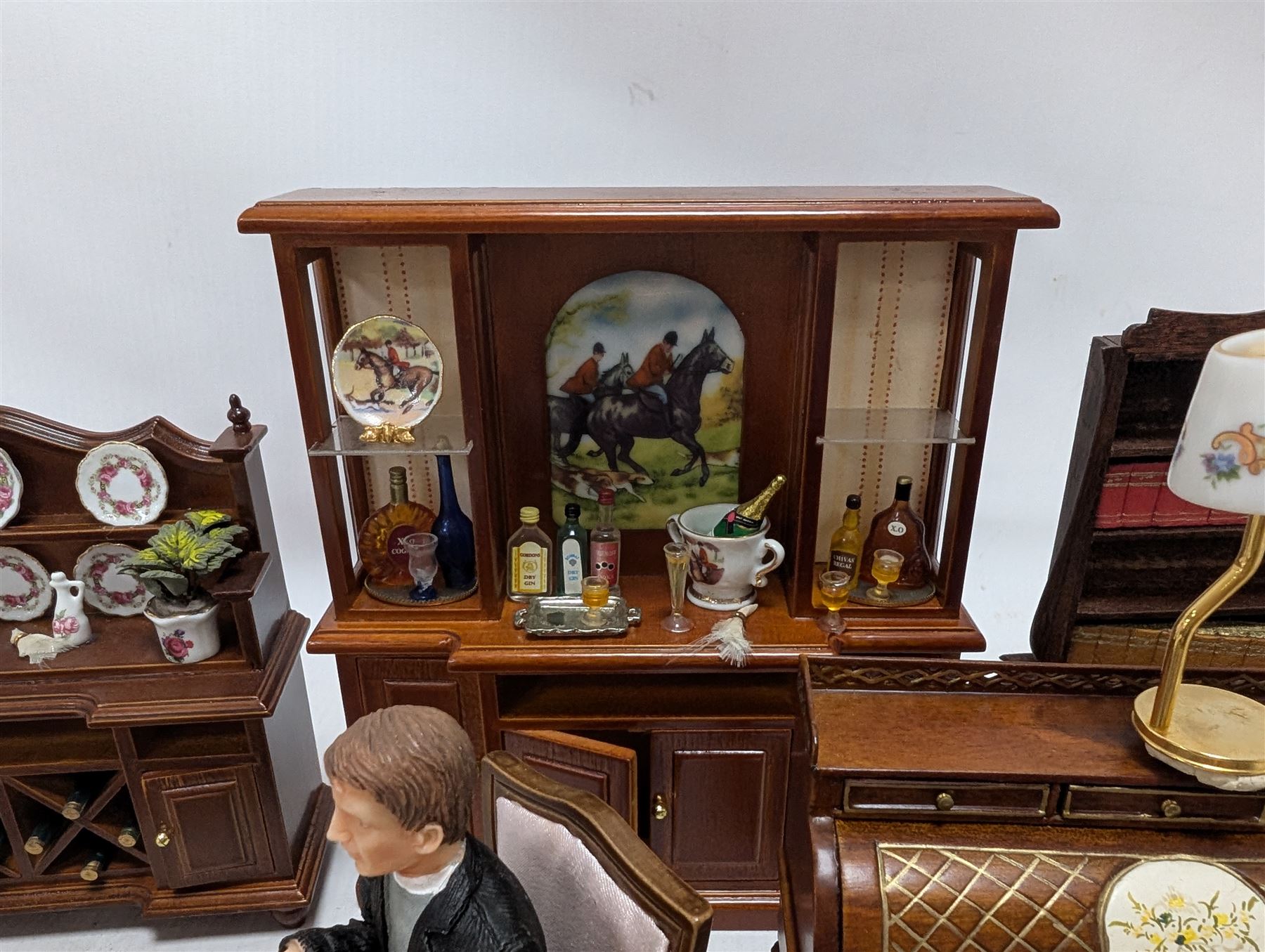 Dolls house drawing room furniture, including dressers, pink and green checked sofa and armchairs, bureau, chairs, piano, eight figures and a collection of afternoon tea miniatures