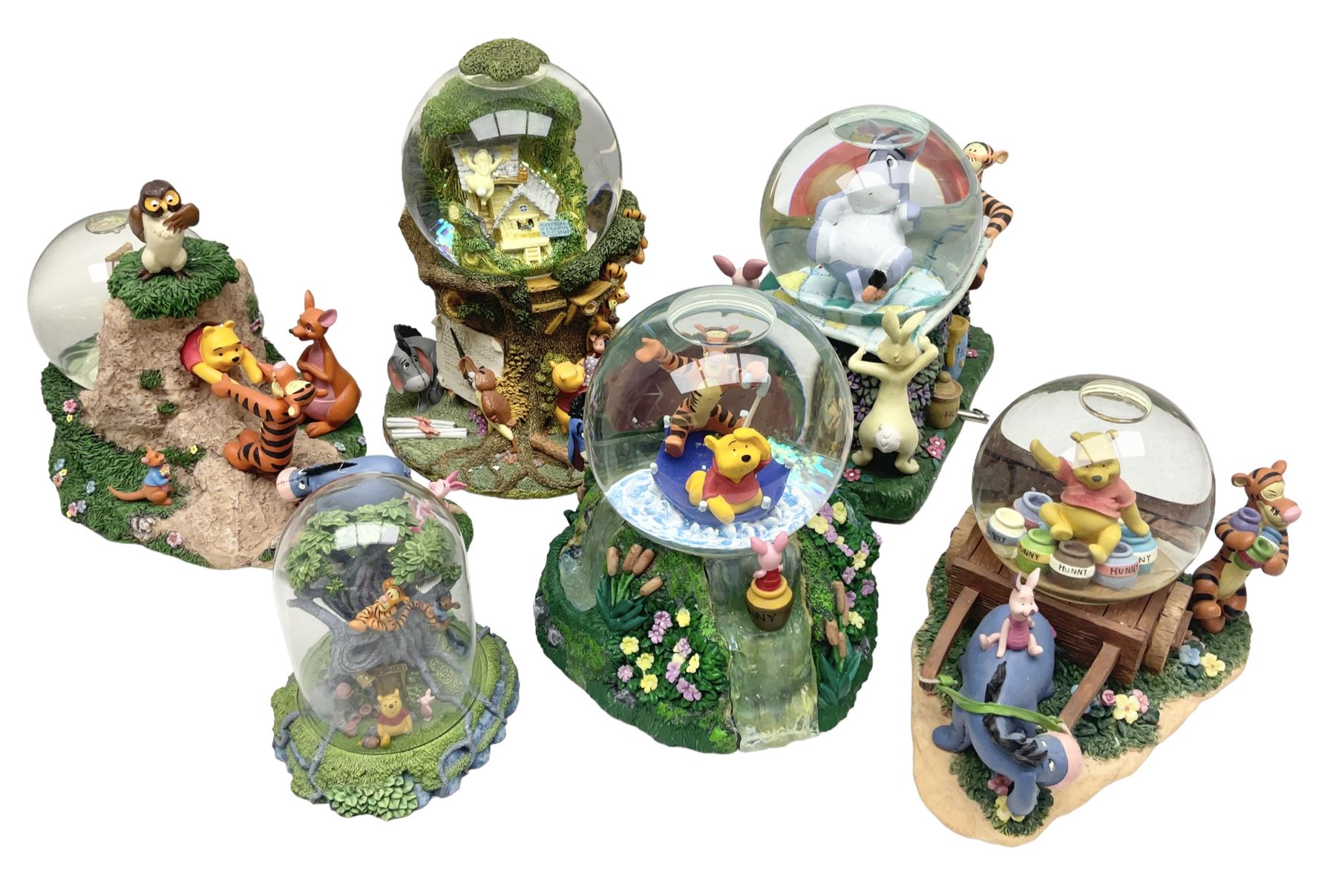 Five Disney Winnie The Pooh snow globes to include The Rain Rain Rain Came Down Down Down, Eeyore Pulling Cart, Owl's House, Rumbly in My Tumbly and Stuck In Rabbit's House, together with figure group with dome, five with boxes (6)