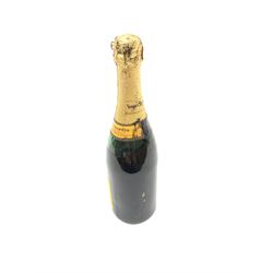 One bottle of Veuve Clicquot Ponsardin 1947 dry champagne, foil seal partially damaged, level below label