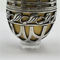 Modern silver limited edition Easter egg, no. 70/500, the gilded body decorated in relief with silver latticework and a band of flower heads, the detachable cover opening to reveal a gilt interior, each hallmarked St James House Company, London 1978, H5.5cm