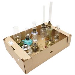 Small table oil lamp with painted glass base and various other small glass and ceramic oil lamps