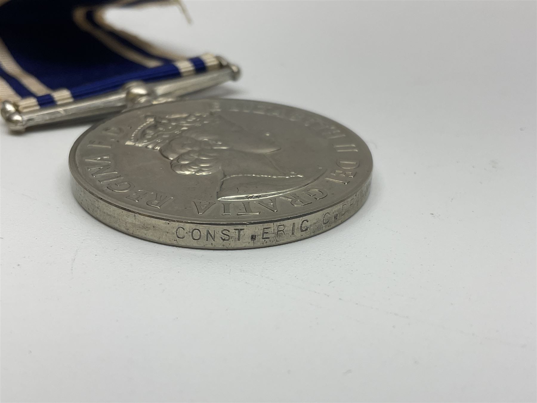 Collection of WW2 and police medals c.1933-1955, awarded to Eric Drinkwater comprising 1939-45 War Medal, Defence Medal, 1939-45 Star and Burma Star, on wearing bar; 1918-62 General Service Medal with Cyprus clasp to P.S. E.G. Drinkwater; boxed; Police Long Service and Good Conduct Medal to Const. Eric C. Drinkwater; cased; Royal Life Saving Society bronze medal to E.C. Drinkwater July 1933; boxed; and George V 1937 coronation medallion; boxed.