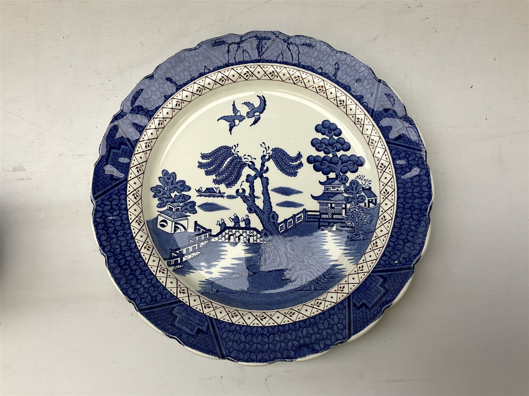 Quantity of blue and white ceramics to include Spode Italian pattern shallow bowl, Booths plate decorated with willow pattern, Wedgwood Jasperware tulip vase, T.G Green Cornish ware lidded storage jar, Delft style ceramics etc in two boxes