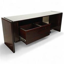 Dyrlund  - contemporary Santos rosewood office sideboard of minimalist form with clean lines, rectangular top with integrated side supports, left side with two drawers, and right side with a filing drawer, all enclosed by sliding doors


Note: Dyrlund is a Danish furniture manufacturer known for its high-quality, handcrafted pieces, particularly in the mid-century modern style. Founded in 1960 by Frits Hjerte Dyrlund in Rude, Denmark, the company has remained a family business, now run by the second and third generations. Dyrlund specializes in both home and executive office furniture, focusing on practicality, solid construction, and classic design. 
