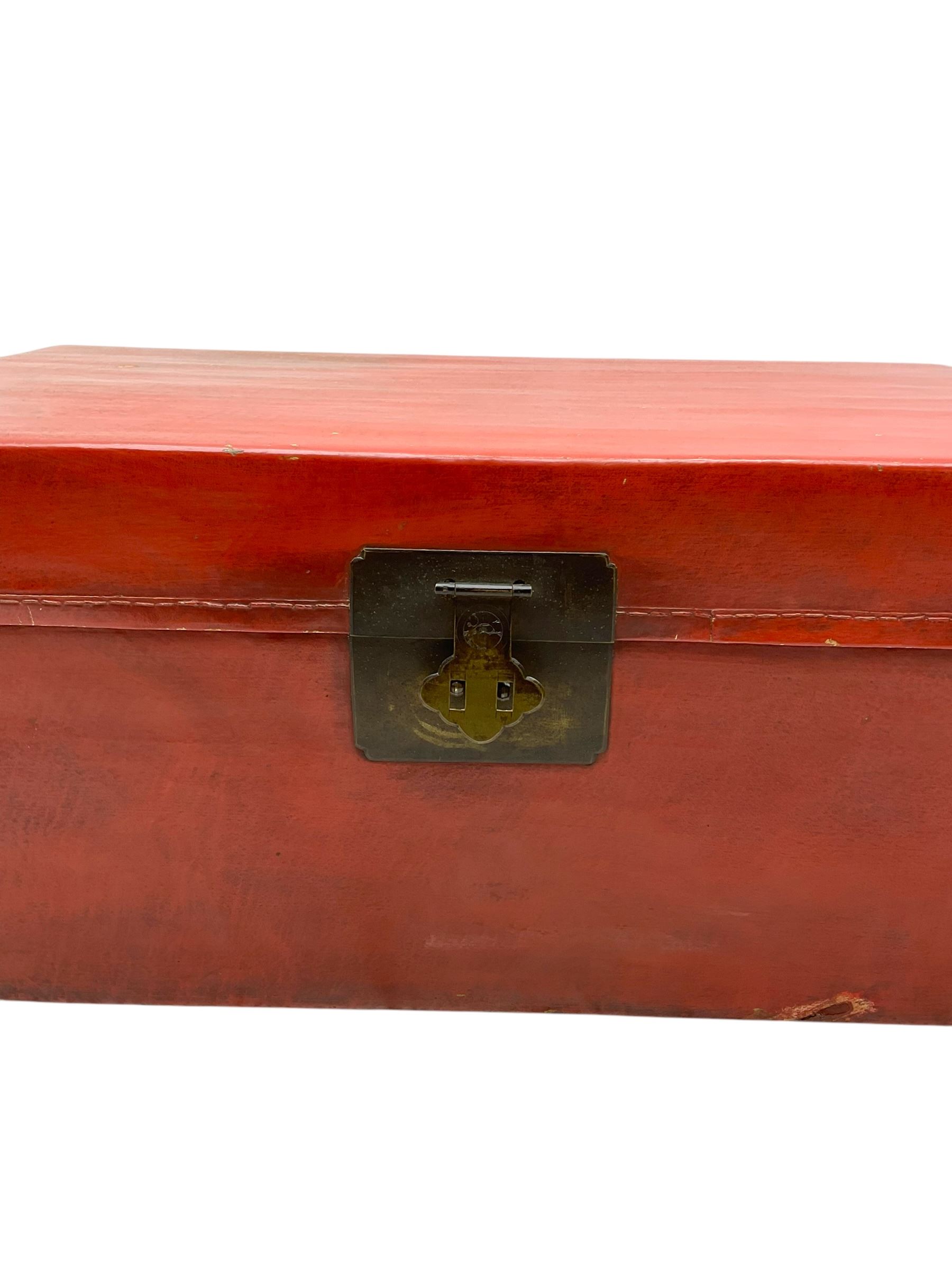 Pair of Chinese 18th century hand-painted leather-bound wooden trunks, each adorned with metal locks, twin carrying handles and patterned fabric-lined interior